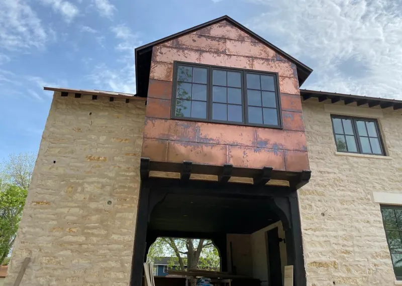Copper metal panel facade on a stone building for Metal Roof Coating in High Point