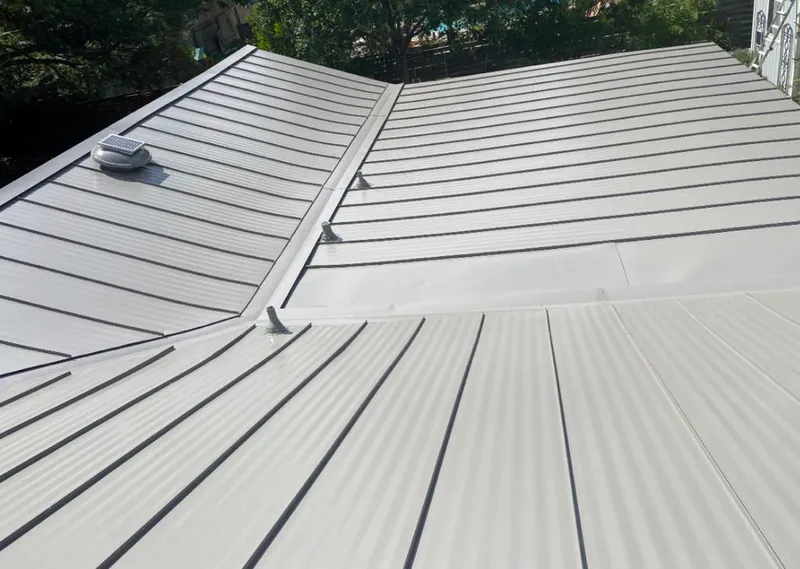 Solar attic fan installed on a metal roof for Roof Ventilation in High Point